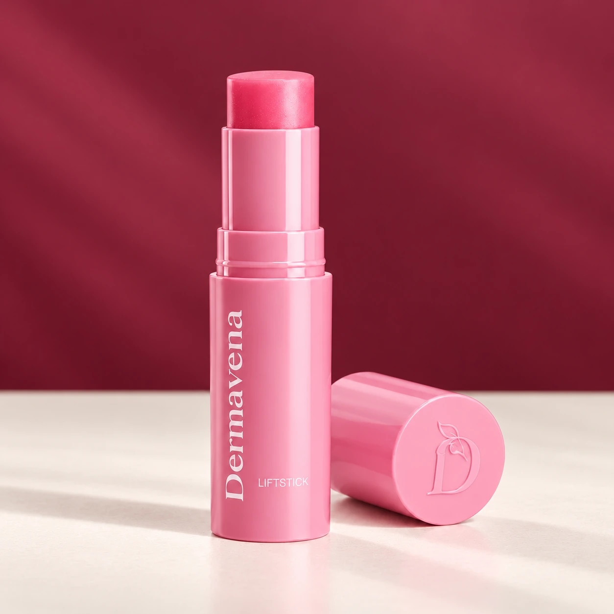 LiftStick Dermavena rose et capuchon sur fond bordeaux